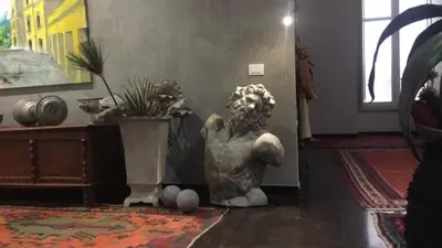 a statue sitting on the floor in a room at Atmosfere Puniche b&b in Palermo