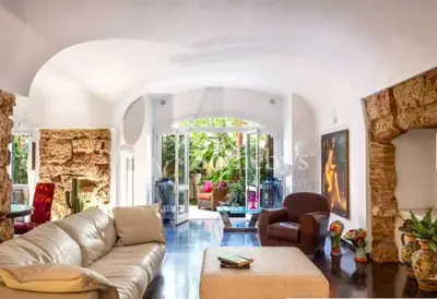 a living room with a couch and a chair at Atmosfere Puniche b&b in Palermo