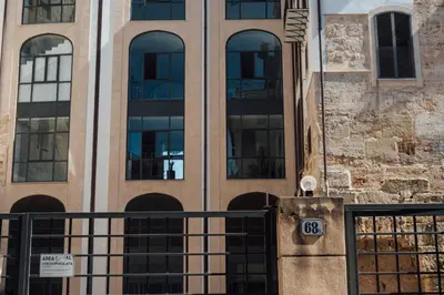 a building with a gate in front of it at Atmosfere Puniche b&b in Palermo