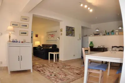 a living room with a couch and a table at Casa Frida in Palermo