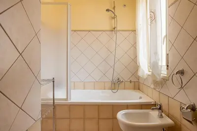 a bathroom with a bath tub and a sink at Villa Salvatore in Capaci