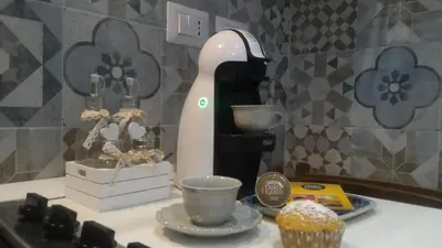 a mixer sitting on a counter next to a cupcake at B&B A casa dell'artista in Casteldaccia