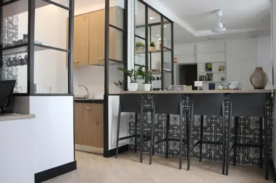 a kitchen with a black and white counter at B&B Vivere Palermo in Palermo