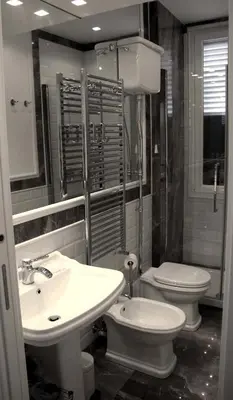 a bathroom with a toilet and a sink at B&B Vivere Palermo in Palermo