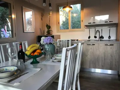 a kitchen with a table with bananas on it at Villa Rosemada, Mondello in Palermo