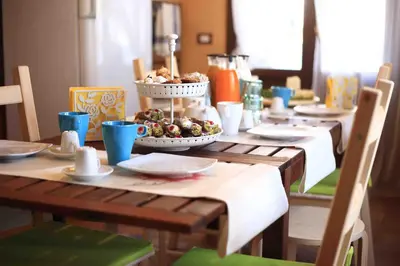 a table with two plates of food on a table at Jardin De France in Palermo