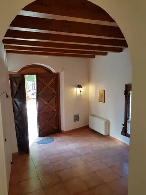 a room with a large door in a house at Boutique House Montevergini in Palermo