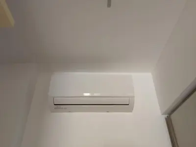 a wall mounted air conditioner in a white room at se vi pare in Palermo