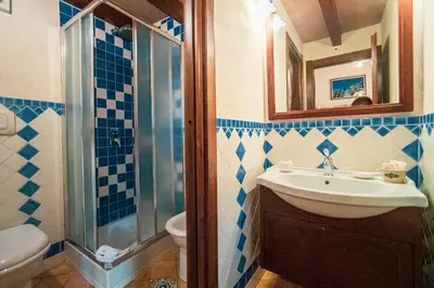 a bathroom with a sink and a shower at Poggio Pozzetti in Lascari