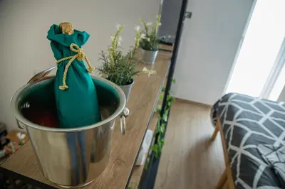 a bucket on a table with potted plants on it at House Orlando in Sferracavallo