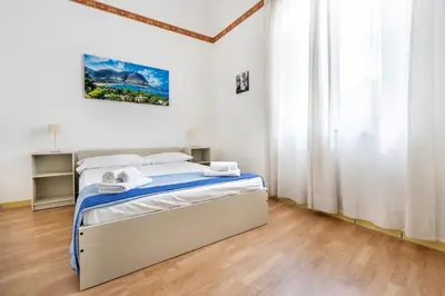 a bedroom with a bed in a room at Porta Carini Residence in Palermo