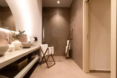 a bathroom with a counter and a sink at Palazzo Natoli Boutique Hotel in Palermo
