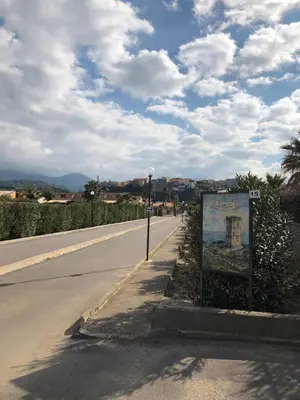 a street with a sign on the side of a road at Villa Aga in Campofelice di Roccella