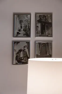 four pictures hanging on a wall in a room at Novelli 36 in Palermo