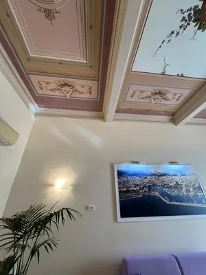 a living room with a painting on the ceiling at SUITE 188 - Welcome in Palermo