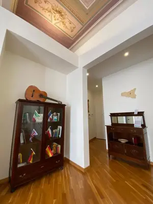 a room with a book shelf with books at SUITE 188 - Welcome in Palermo