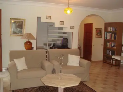 a living room with two couches and a table at Villa Paloma in Castellammare del Golfo