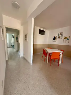 a dining room with a table and two chairs at Yucca Apartment in San Vito lo Capo