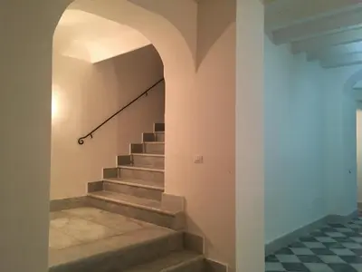 a staircase in a house with an archway at Discesa Delle Capre Studio Confort in Palermo