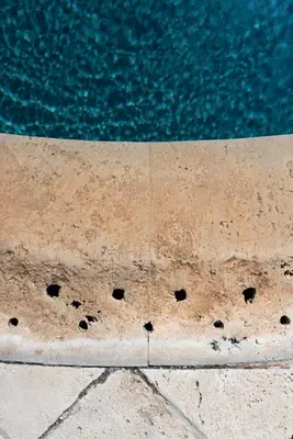 a close up of a pool with holes in the ground at Tenute Baglio Passofondo in Alcamo