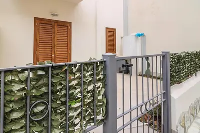 a balcony with a plant on the wall at CASA 