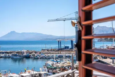 a view of a harbor from a window at Stenopus Greco Casa per AFFITTI TURISTICI in Santa Flavia