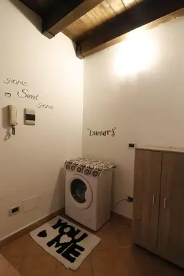 a bathroom with a washing machine in a room at Casa Palazzo Reale in Palermo
