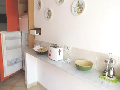 a kitchen with a counter with some bowls on it at Appartamento Libertà in Palermo