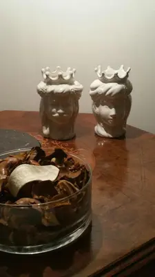two vases sitting on a table with a bowl of food at Penthouse Luxury Quattro Canti in Palermo