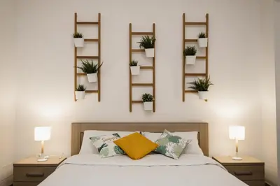 a bedroom with potted plants on the wall at LuminHouse Mondello Fico in Mondello