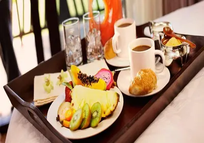 a tray with two plates of food and cups of coffee at LuminHouse Mondello Zibibbo in Mondello
