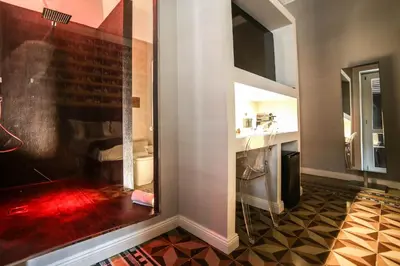 a room with a bathroom with a sink and a mirror at Family Affair Luxury Rooms&Suites in Palermo