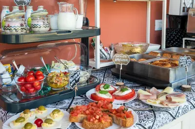 a buffet with many different types of food on a table at Ciccio Rooms and breakfast - Self check-in in Palermo