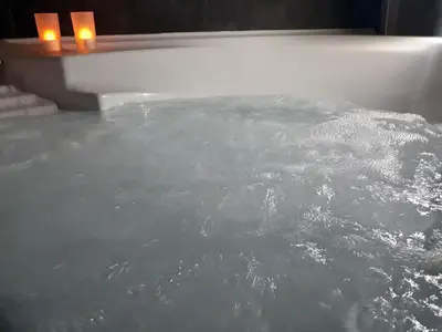 a bath tub filled with lots of boiling water at SuiteSicily Rooms Palermo in Altavilla Milicia