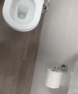 a bathroom with a toilet and a roll of toilet paper at Casa Vacanza Isola sul Mare in Castellammare del Golfo