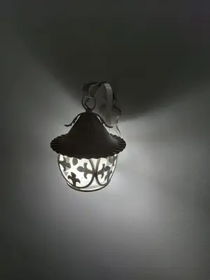 a light fixture hanging from a wall at Terrazza New Homes in Castellammare del Golfo