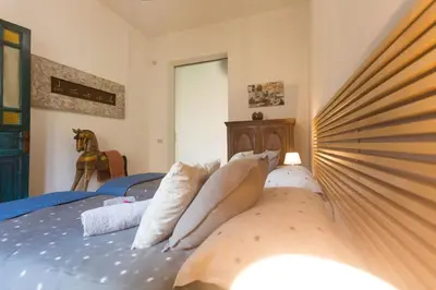 a bedroom with a bed with towels on it at Large terrace apartment near Politeama in Palermo
