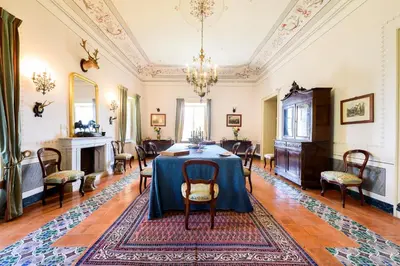a dining room with a table and chairs at Masseria Rossella in Piana degli Albanesi