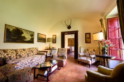 a living room with a couch and chairs at Masseria Rossella in Piana degli Albanesi