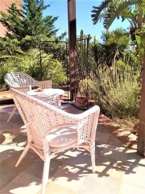 two wicker chairs and a table on a patio at VILLA TREROSE by Trerose Properties - Villa centrale con wi-fi e posto auto privato gratuiti in San Vito lo Capo