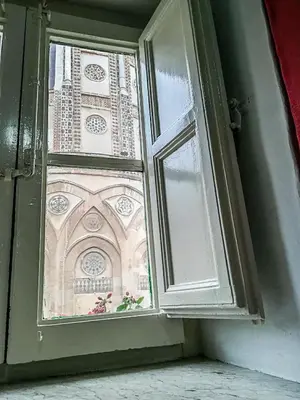 a window with a view of a church at Vivere la Ciambra in Monreale