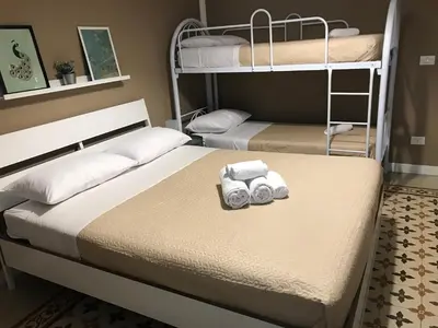 a bedroom with two bunk beds with towels at Jennys place in Palermo