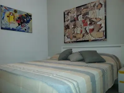a bed with two pillows on it in a room at Il Mulino in San Vito lo Capo
