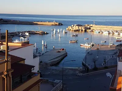 a view of a harbor with boats in the water at La Rosa dei Venti in Isola delle Femmine
