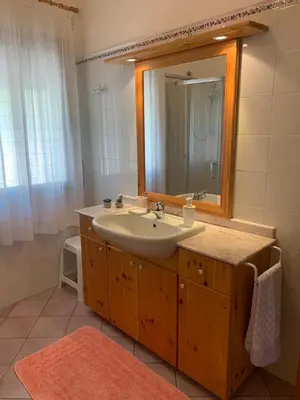a bathroom with a sink and a mirror at Villa Cycas Costamante in Castellammare del Golfo