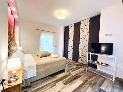 a hotel room with a bed and a television at Casa di Ivana in Carini