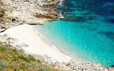 an aerial view of a beach with blue water at Villa Plaia in Castellammare del Golfo