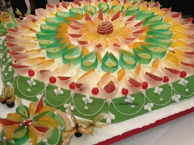 a cake with a flower on top of it at Villa Plaia in Castellammare del Golfo