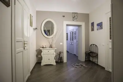 a hallway with a mirror and a table with a mirror at Kalatfimi b&b in Palermo