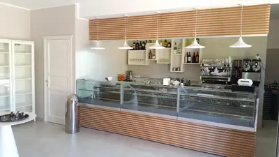 a kitchen with a counter with aperature at Residence Le Piscine in San Vito lo Capo